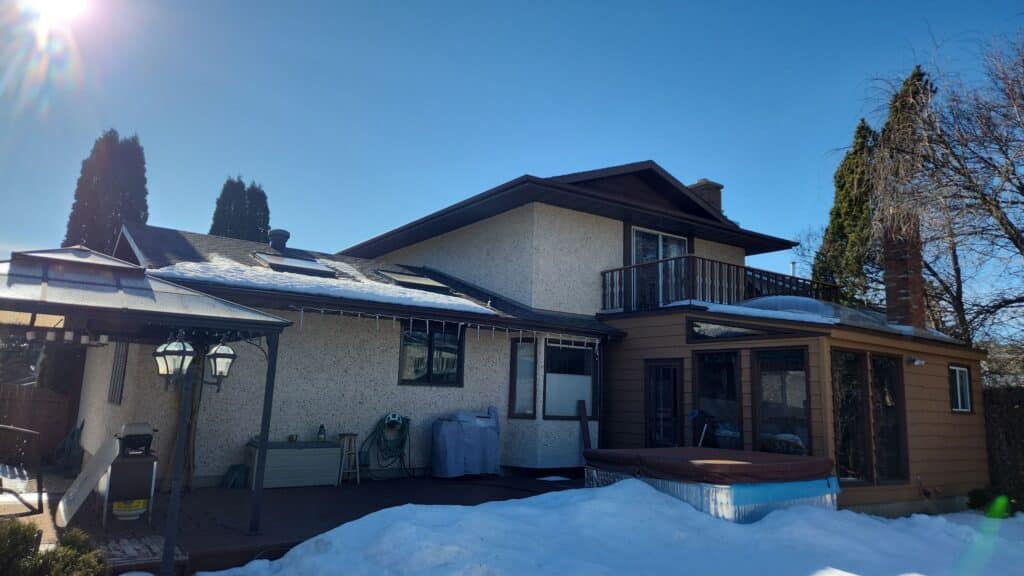 An Edmonton Home in the early Spring with some snow still on the roof, ready for a Spring Inspection.