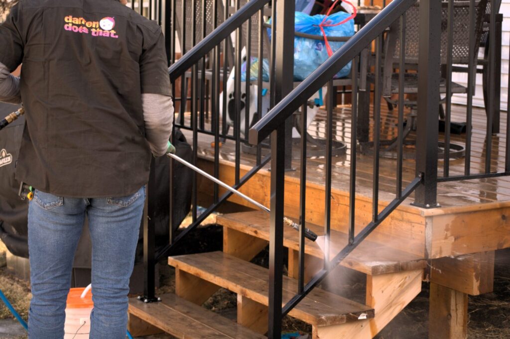 Pressure Washing - finishing off the stairs scaled 1