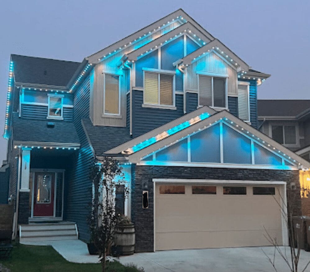 Two-story house with blue exterior lights